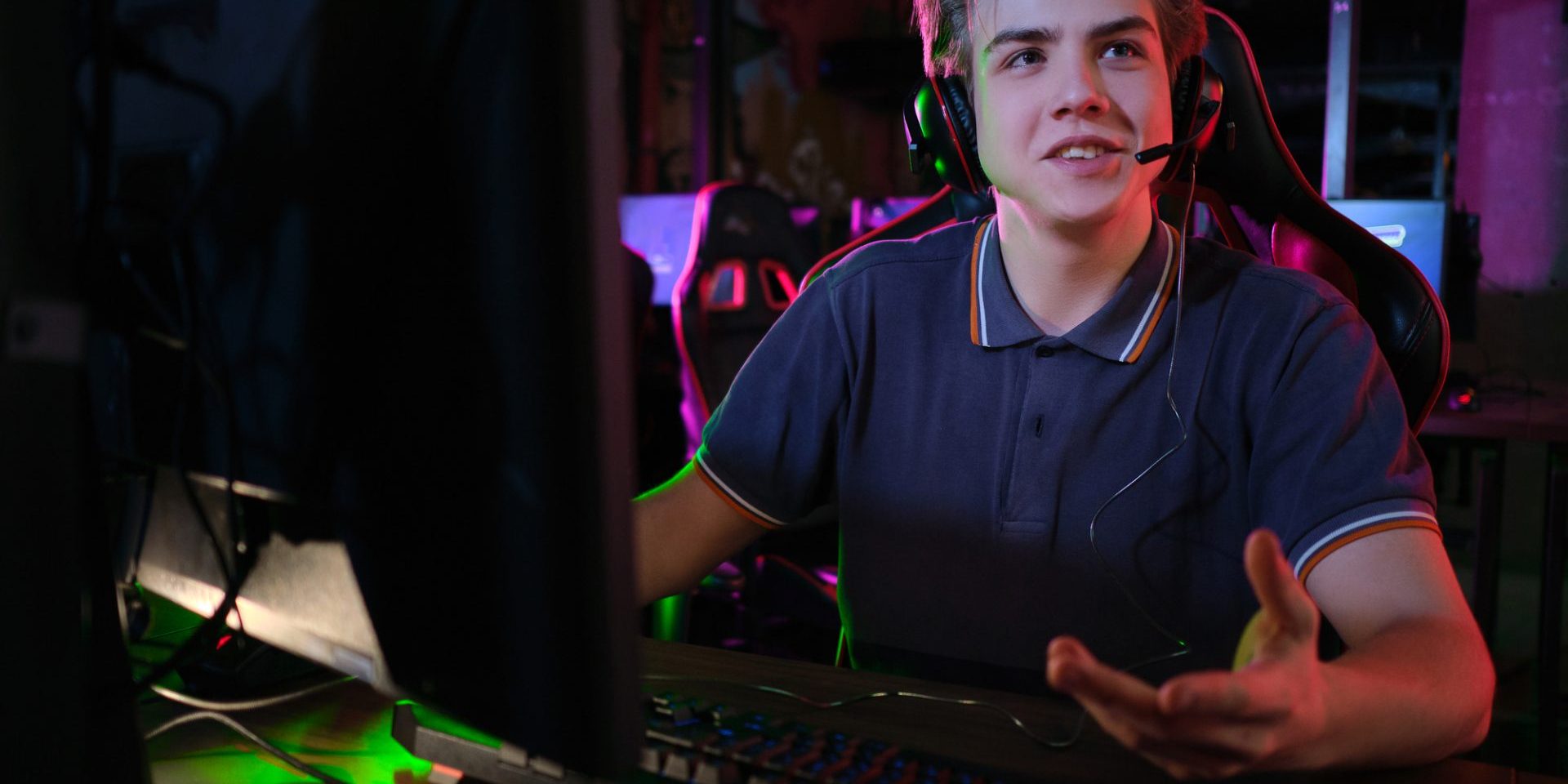 Professional photo of young male caucasian cyber sportsman in gaming club training for important match.