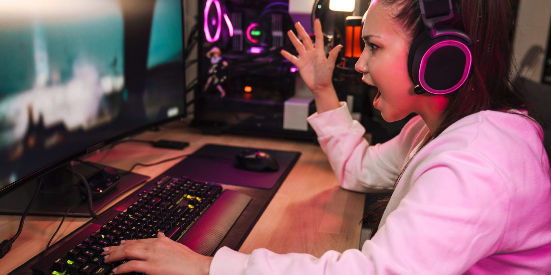 Angry devastated young man gamer wearing headphones lost a game on computer